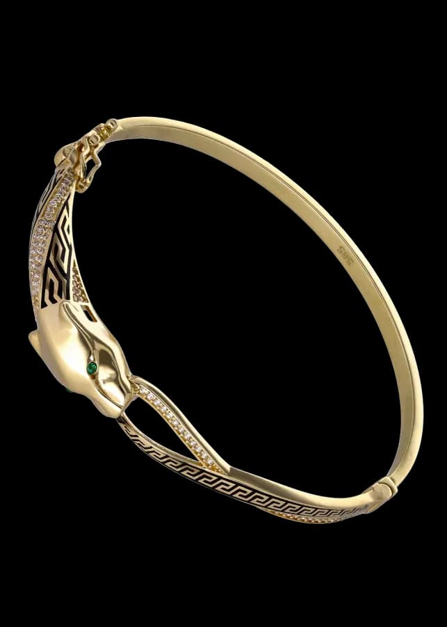 Pulseira de bracelete com cabeça de pantera dourada, olhos verdes, diamantes e esmalte